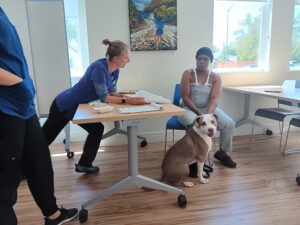 Veterinarian talk with a pet guardian during a visit of Valley Humane's Field Vet program.